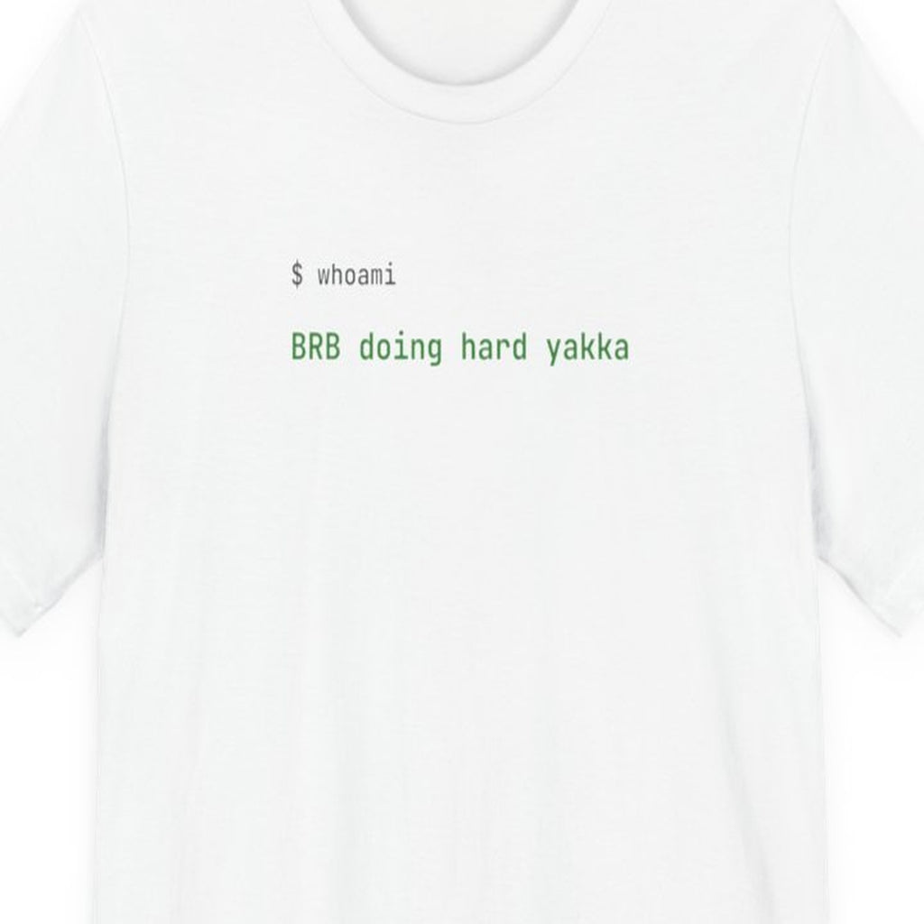 Black t-shirt with "BRB Doing Hard Yakka" text in monospace font, developer humor about AI coding assistance