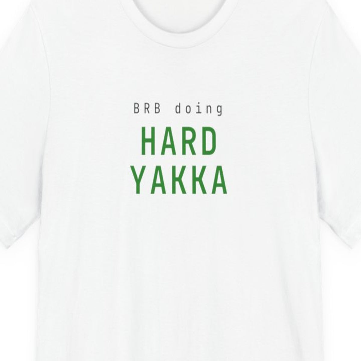 Black t-shirt with "BRB Doing Hard Yakka" text in amber terminal-style font on dark background