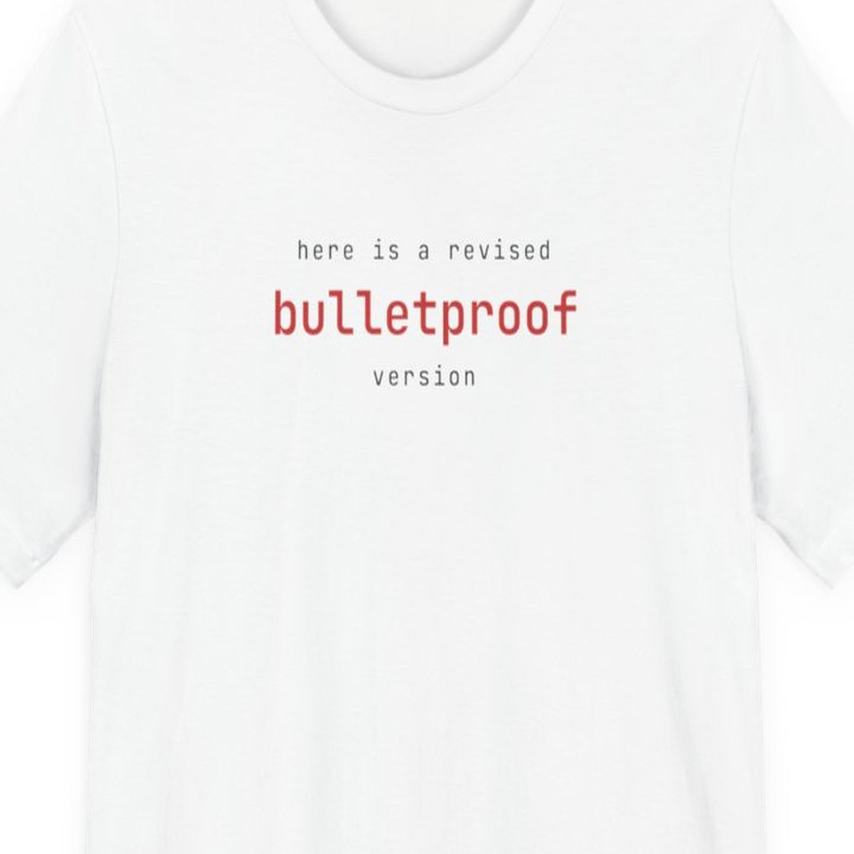 Black t-shirt with white text reading "Here Is a Revised Bulletproof Version" in monospace font