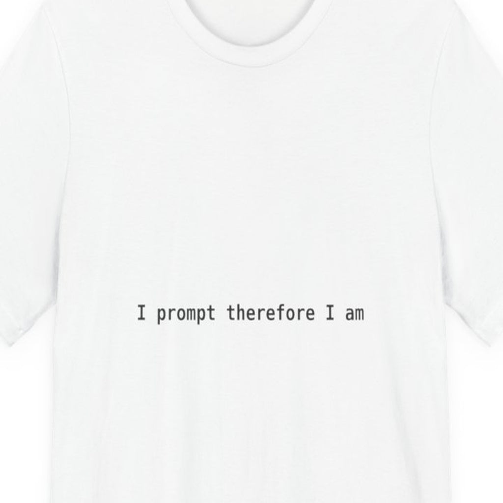 Black t-shirt with white text reading "I Prompt Therefore I Am" in monospace font, philosophical coding humor design