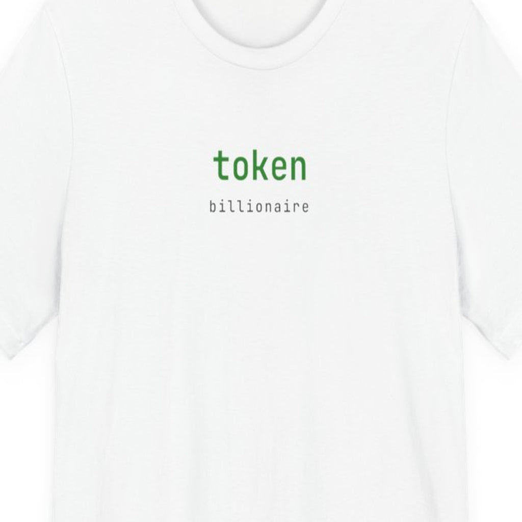 Black t-shirt with "Token Billionaire" text in amber terminal-style font, developer humor design