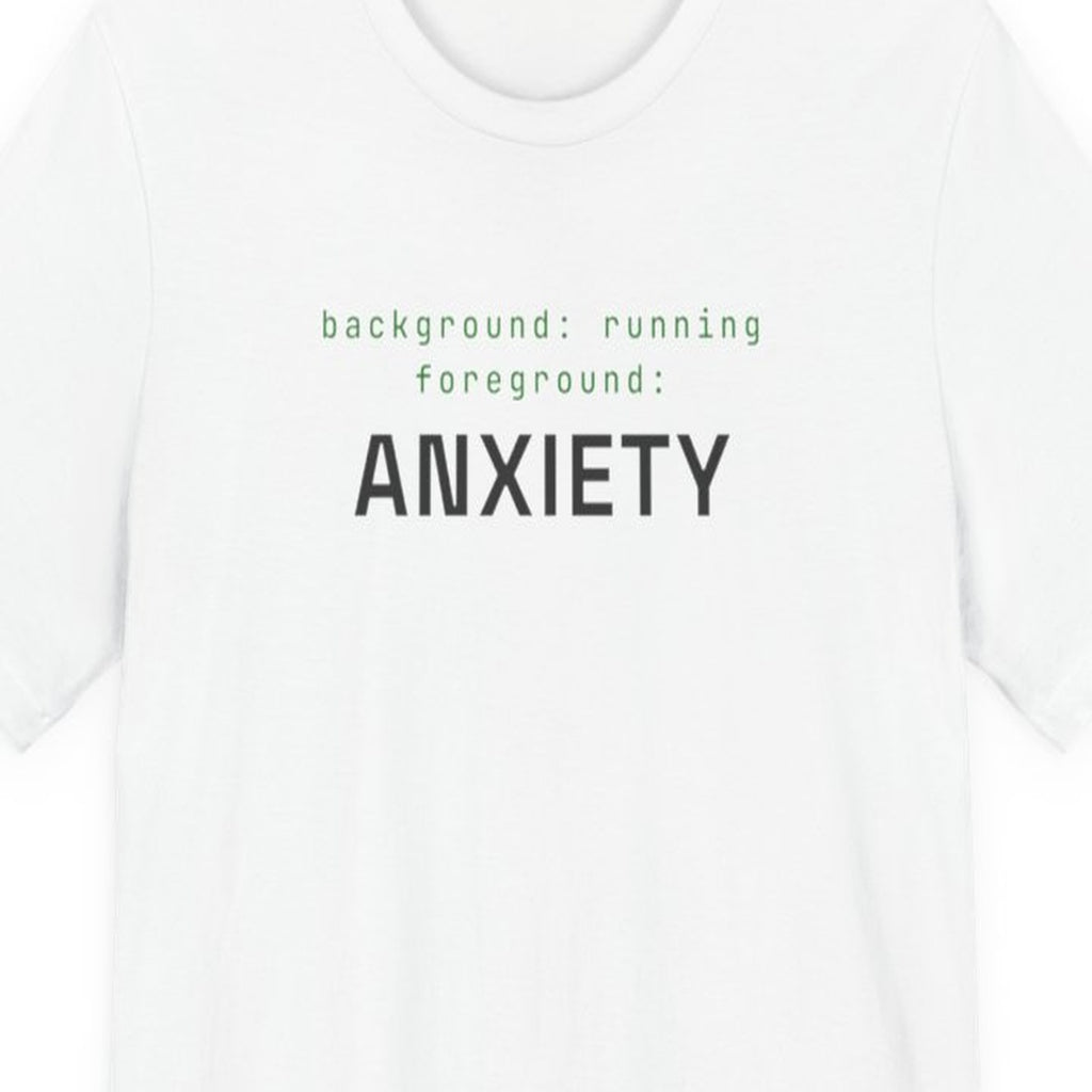 Black t-shirt with white text reading "Background Task, Foreground Anxiety" in monospace developer font
