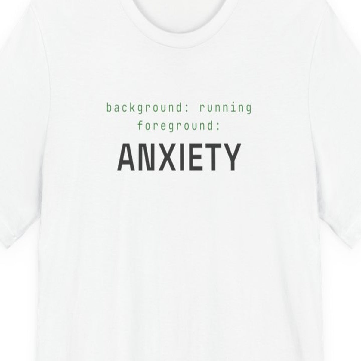 Black t-shirt with white text reading "Background Task, Foreground Anxiety" in monospace developer font