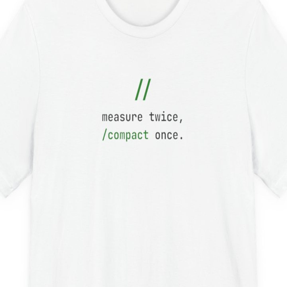 Black t-shirt with white monospace text reading "Measure Twice, /compact Once" in terminal-style font