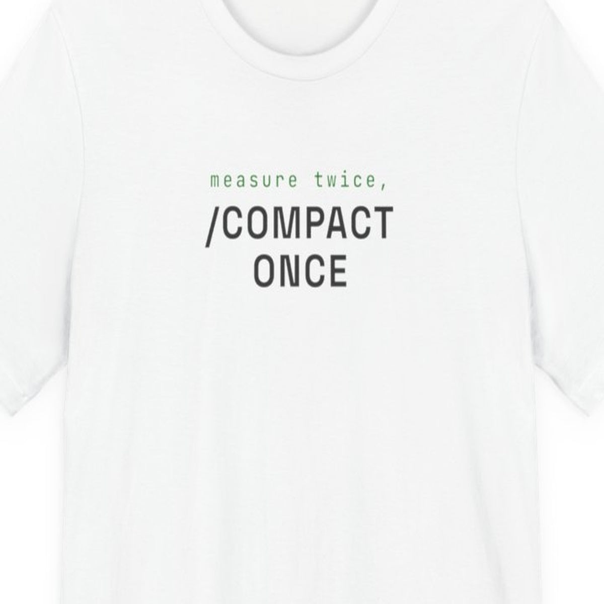 Black t-shirt with white text reading "Measure Twice, /compact Once" in monospace font on dark background