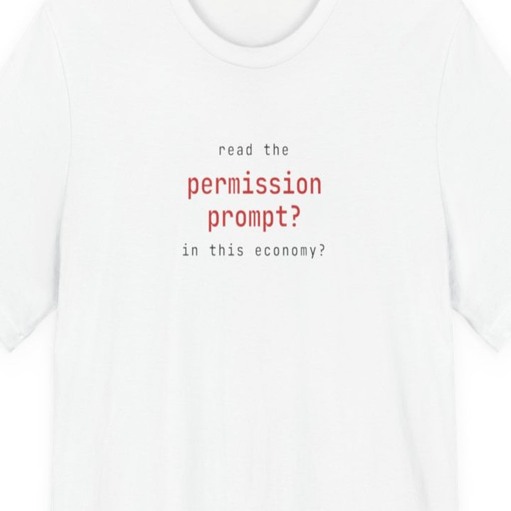 Black t-shirt with white text reading "Read the Permission Prompt? In This Economy?" in monospace developer font