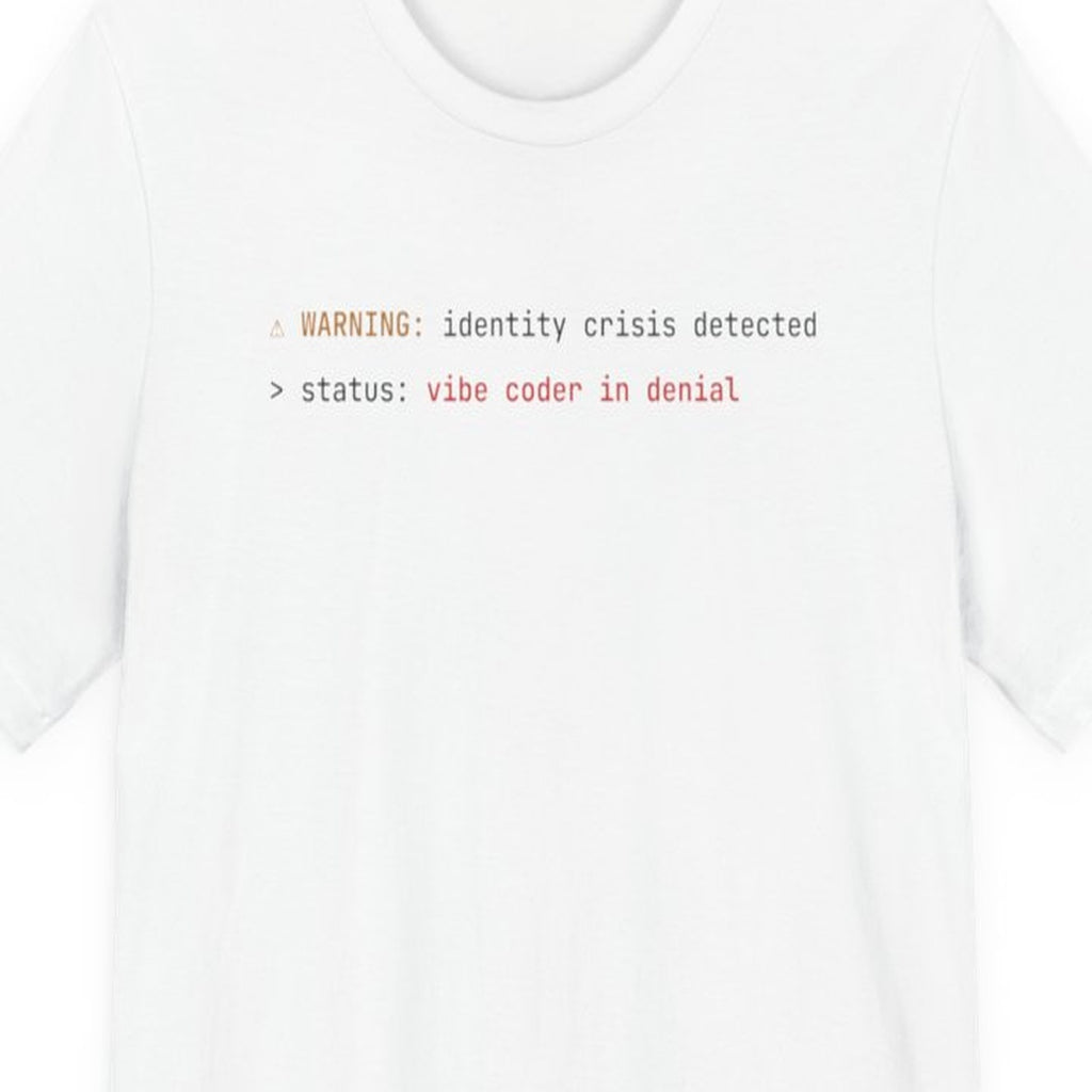 Black t-shirt with "Vibe Coder in Denial" text in amber monospace font, developer humor design
