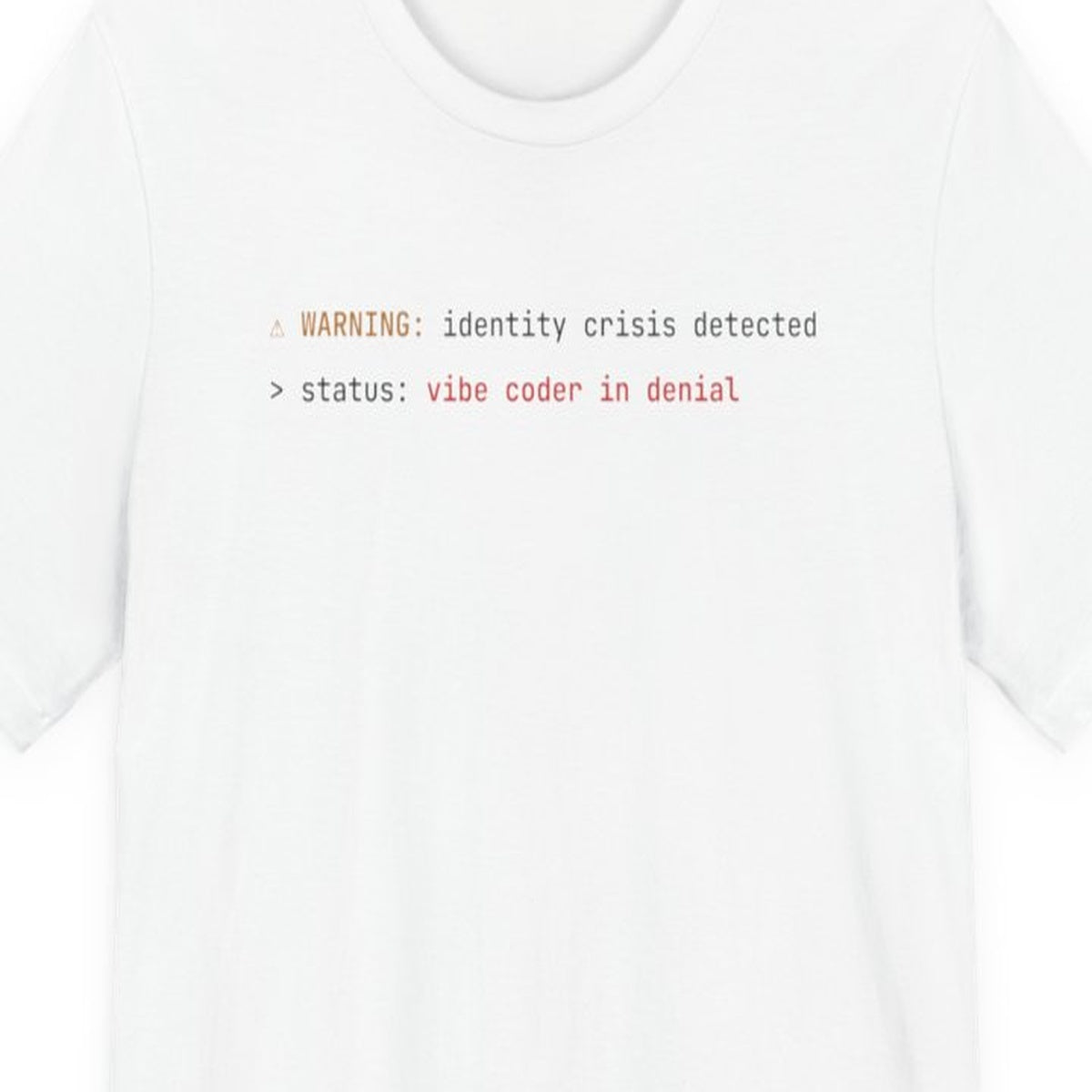Black t-shirt with "Vibe Coder in Denial" text in amber monospace font, developer humor design