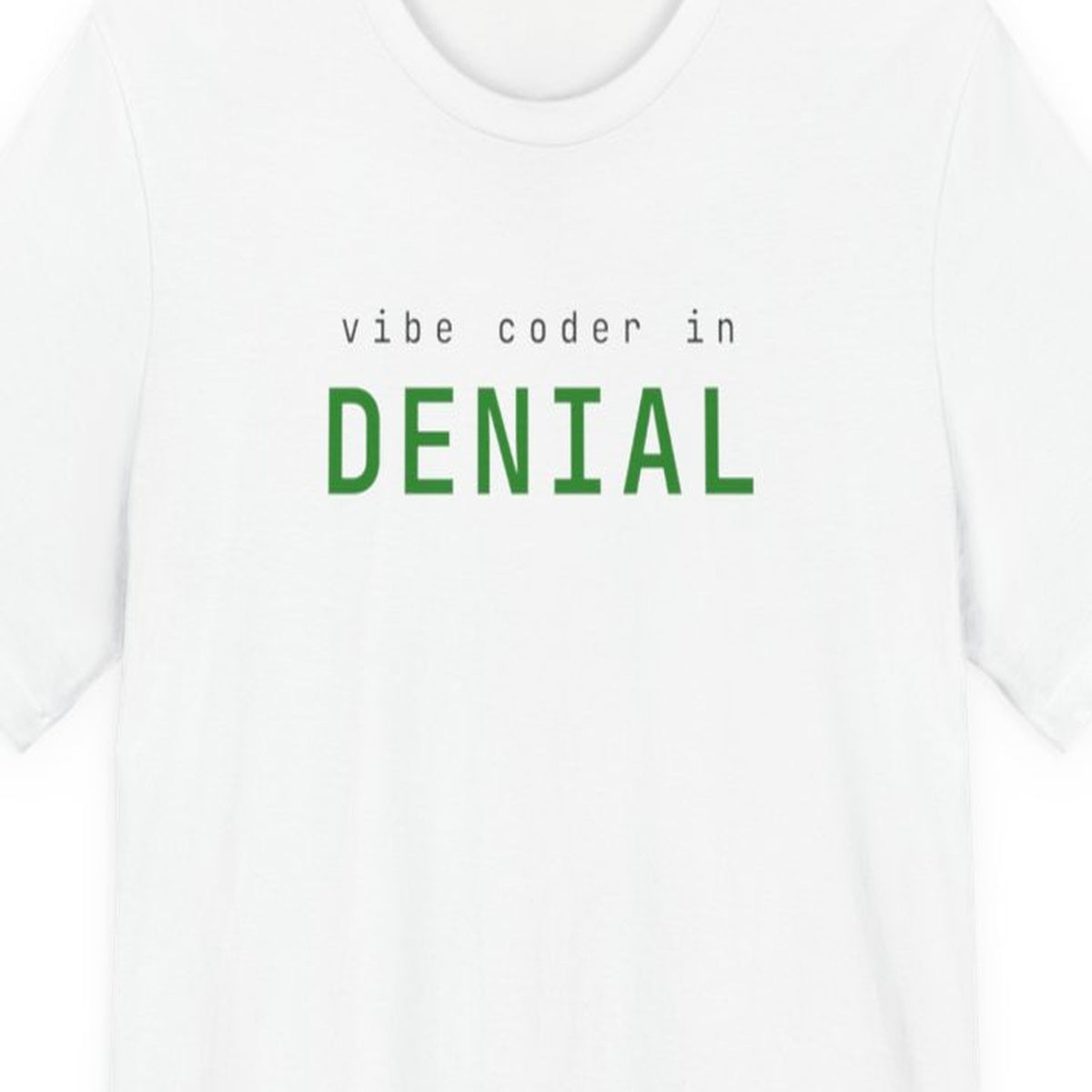 Black t-shirt with "Vibe Coder in Denial" text in amber terminal-style font on dark background