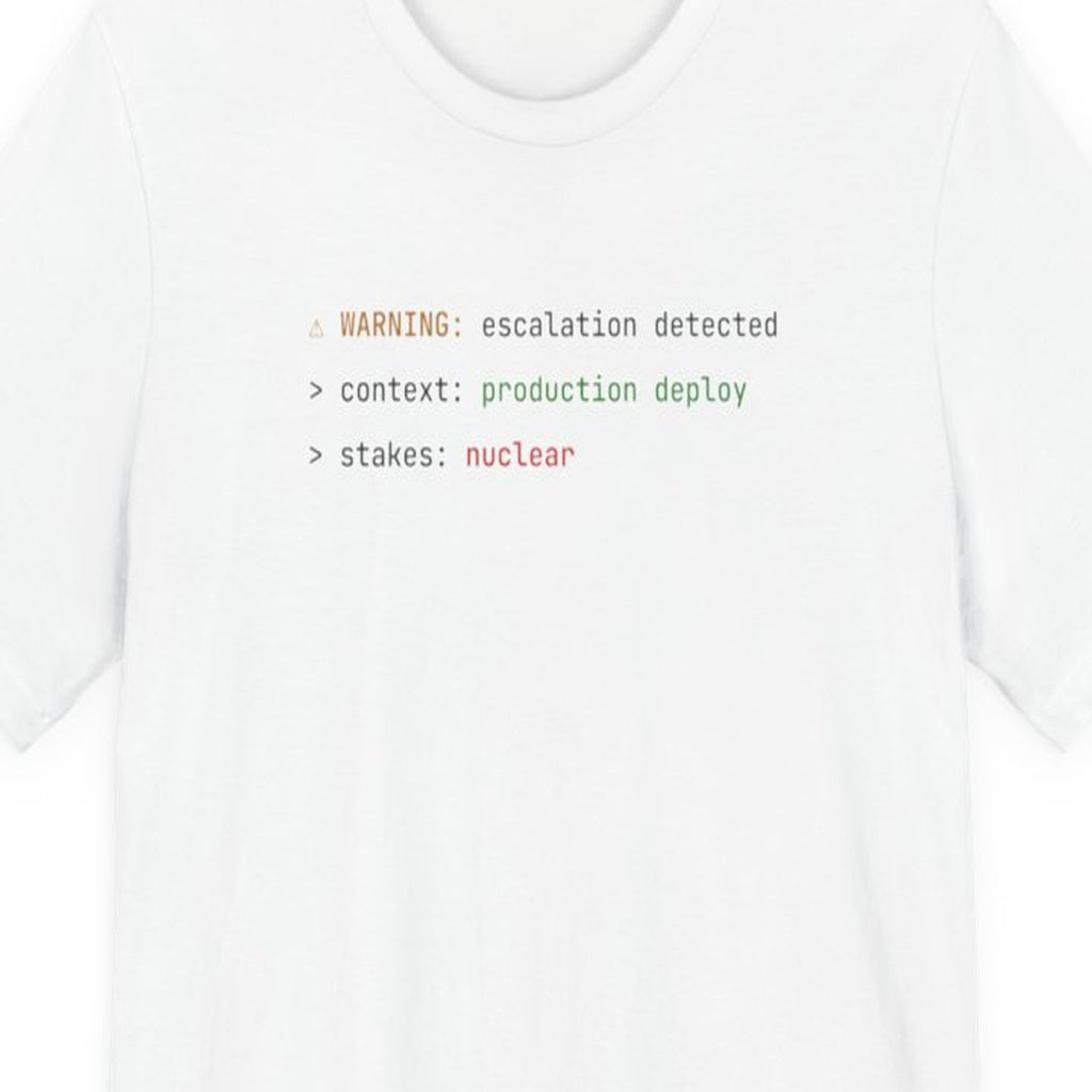 Black t-shirt with "Stakes: Nuclear" text in amber terminal font, worn by person against dark background