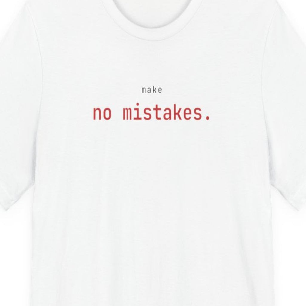 Black t-shirt with white text reading "Make No Mistakes." in terminal font style