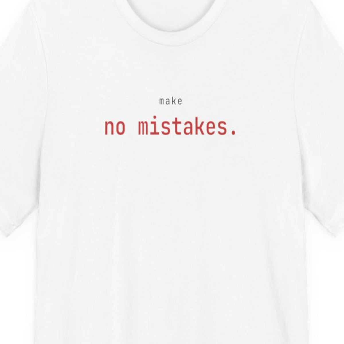 Black t-shirt with white text reading "Make No Mistakes." in terminal font style