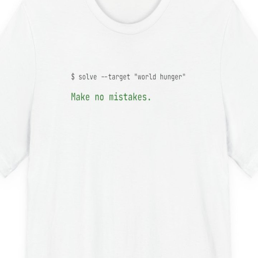 Black t-shirt with white text reading "Solve World Hunger. Make No Mistakes." in monospace terminal font
