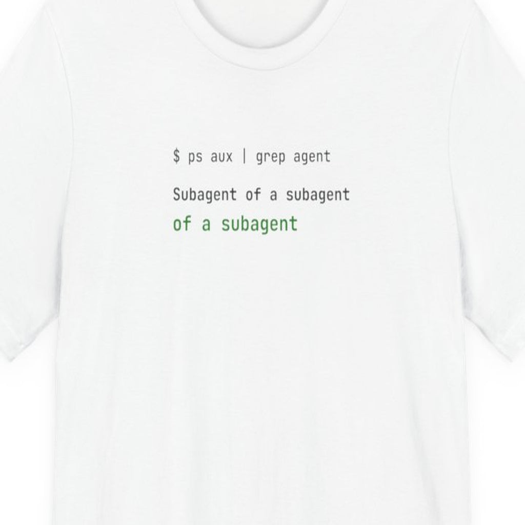 Black t-shirt with "Subagent of a Subagent" text in amber monospace font, referencing AI coding tool delegation chains