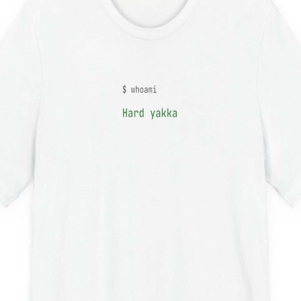 Black t-shirt with "Hard Yakka" text in terminal-style amber lettering, developer coding humor design